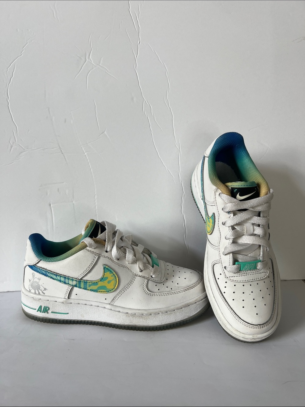 Nike Kids White Sneakers with Teal and Yellow Accents